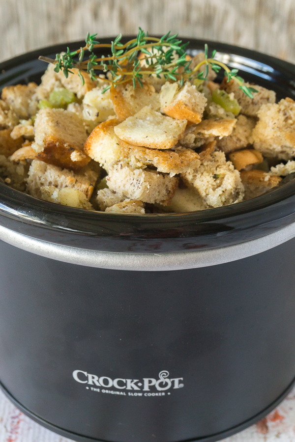 Save oven space by making your stuffing in the slow cooker. My slow cooker Christmas Stuffing is my most requested holiday dish and it's so easy to make.