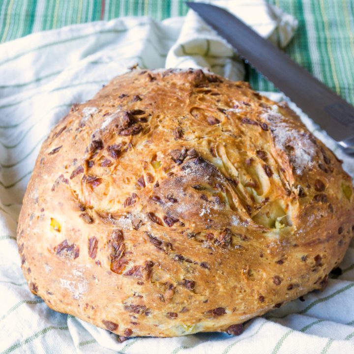 This Rustic Green Chile Cheese Bread is such an easy bread to make and has such great flavor from the cheese and chiles and such a nice texture.  Cooking it without a pan and in a wood fired pizza oven gives it a rustic feel. 