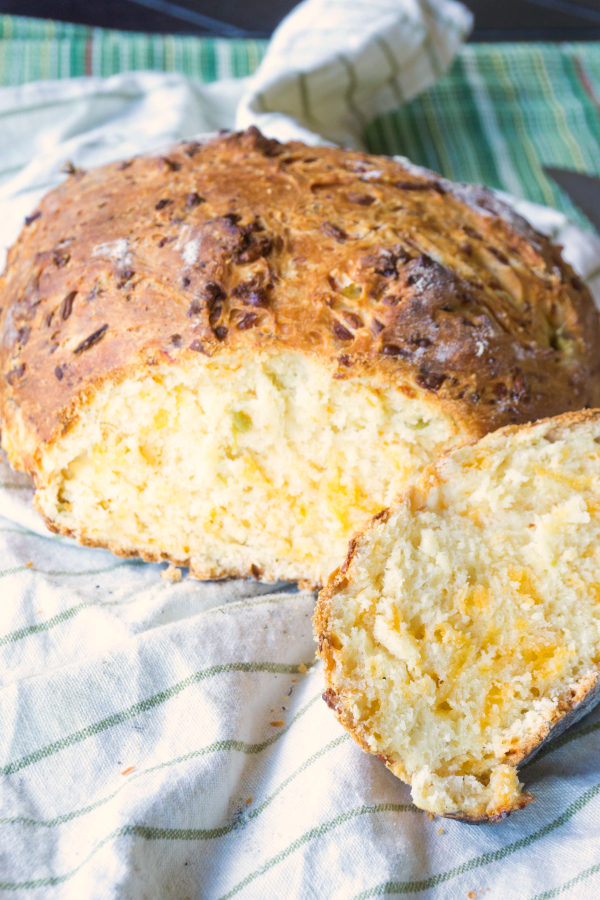 This Rustic Green Chile Cheese Bread is such an easy bread to make and has such great flavor from the cheese and chiles and such a nice texture.  Cooking it without a pan and in a wood fired pizza oven gives it a rustic feel. 