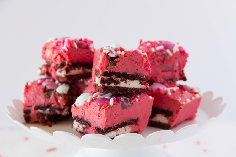 This Red Velvet Fudge is layered with chocolate sandwich cookies and loads of Valentine chocolates and sprinkles. It's a simple gourmet fudge recipe that is festive and delicious.