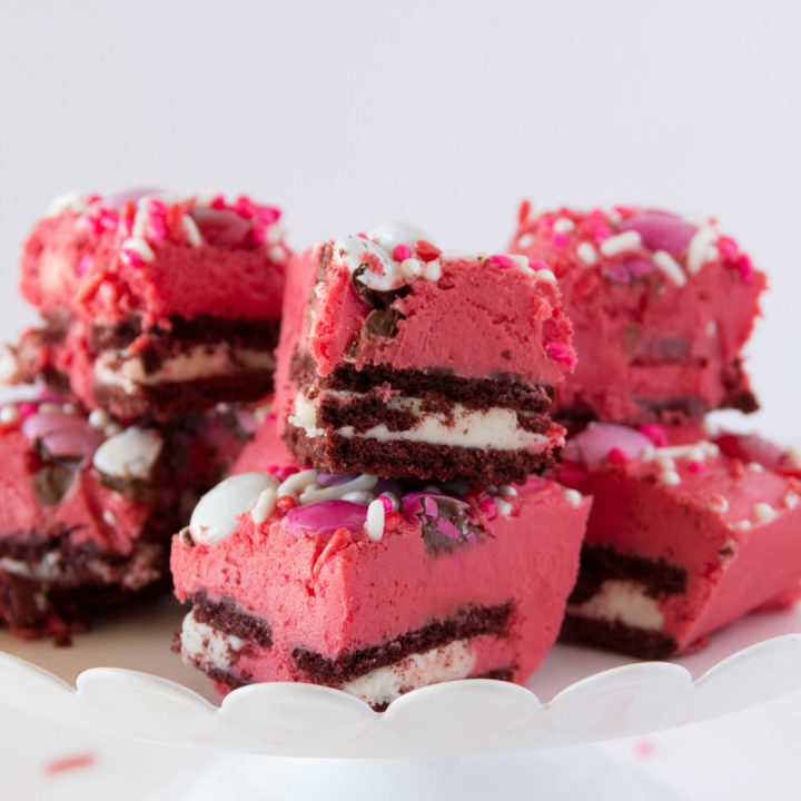 This Red Velvet Fudge is layered with chocolate sandwich cookies and loads of Valentine chocolates and sprinkles. It's a simple gourmet fudge recipe that is festive and delicious.