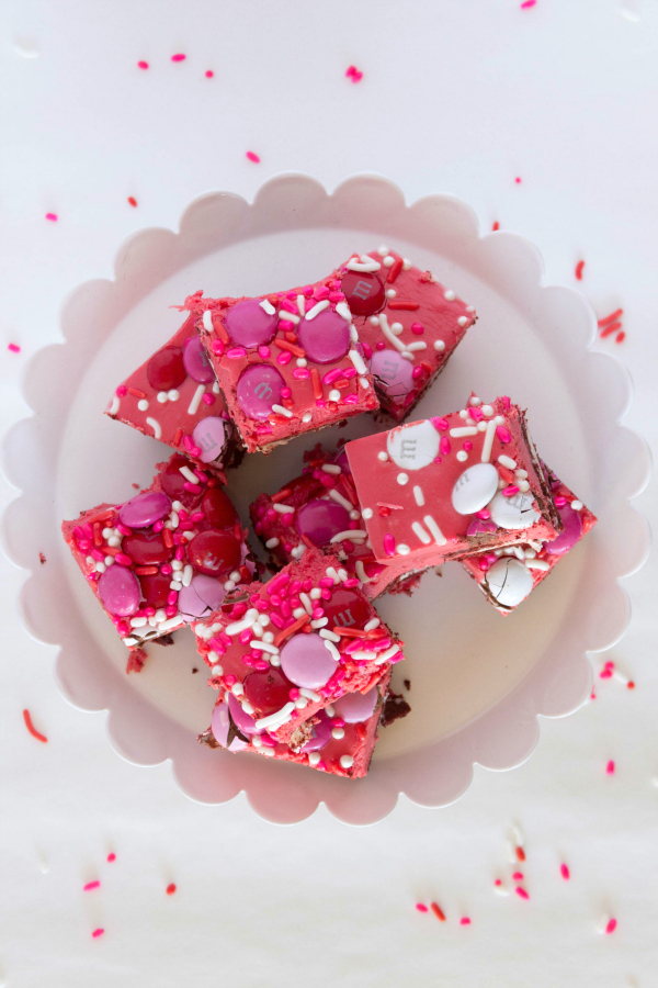 This Red Velvet Fudge is layered with chocolate sandwich cookies and loads of Valentine chocolates and sprinkles. It's a simple gourmet fudge recipe that is festive and delicious.