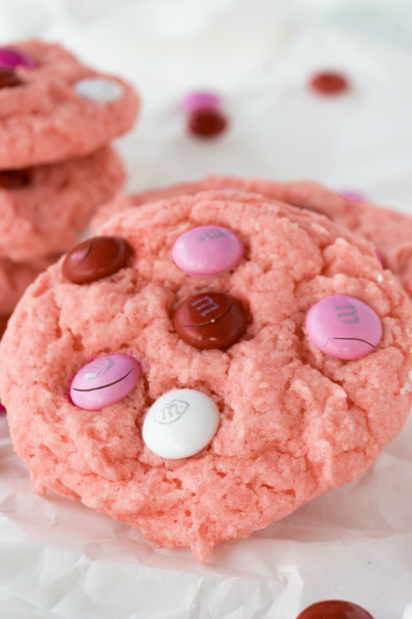 Celebrate your love with a batch of Strawberry Valentine Cookies. These cake mix cookies have a light strawberry flavor and topped off with valentine chocolate candies, sort reminds me of chocolate covered strawberries.