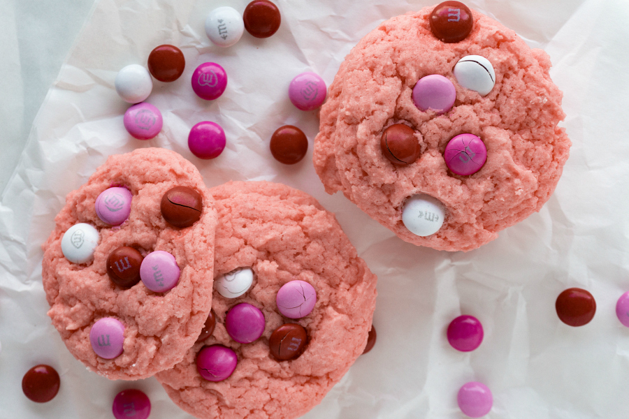 Celebrate your love with a batch of Strawberry Valentine Cookies. These cake mix cookies have a light strawberry flavor and topped off with valentine chocolate candies, sort reminds me of chocolate covered strawberries.