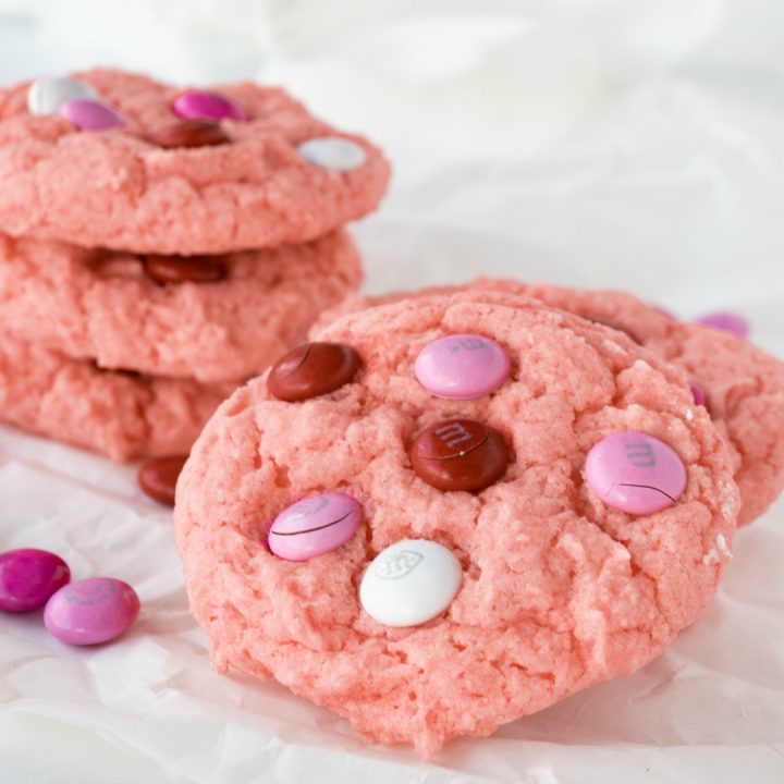 Celebrate your love with a batch of Strawberry Valentine Cookies. These cake mix cookies have a light strawberry flavor and topped off with valentine chocolate candies, sort reminds me of chocolate covered strawberries.
