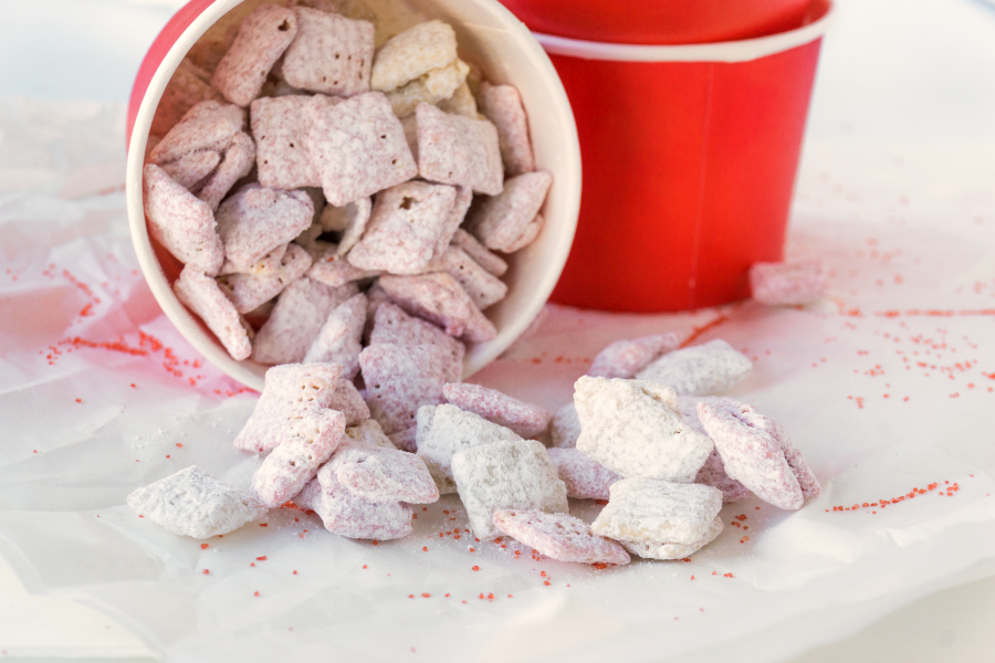 All you need is 15 minutes for these strawberry flavored Valentine Muddy Buddies. They are such a fun and easy valentine party treat that everyone will love. 
