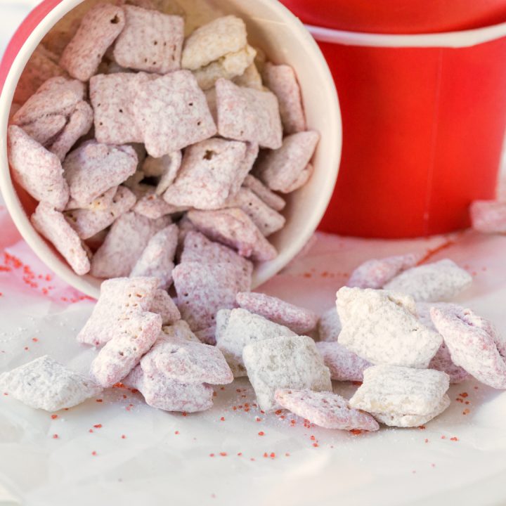 All you need is 15 minutes for these strawberry flavored Valentine Muddy Buddies. They are such a fun and easy valentine party treat that everyone will love. 