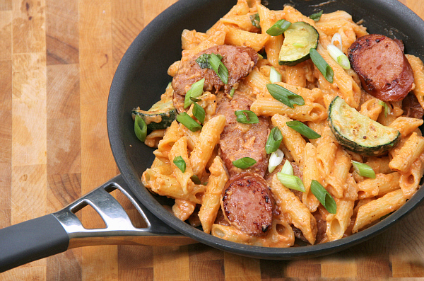 This spicy Sriracha Cream Sauce with Kielbasa is total comfort food and is on the table in under 30 minutes, including the pasta!