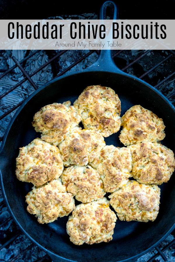 I've kicked up my traditional buttermilk biscuits and added loads of cheddar and chives.  My Cheddar Chive Biscuits are absolutely mouth watering whether cooked in the oven or over a campfire. #castiron #campingrecipes #camping #biscuits #cheedarchive #dropbiscuits #castironrecipes via @slingmama