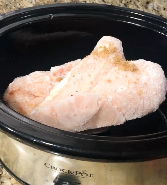 raw chicken in a slow cooker