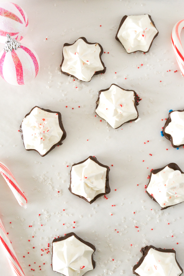 star shaped peppermint meringues on white parchment paper