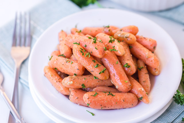 roasted baby carrots on white plate