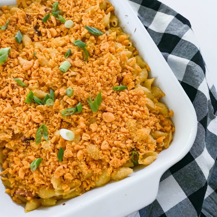 Baked Ham & Cheese Pasta Casserole in white pan with checkered napkin