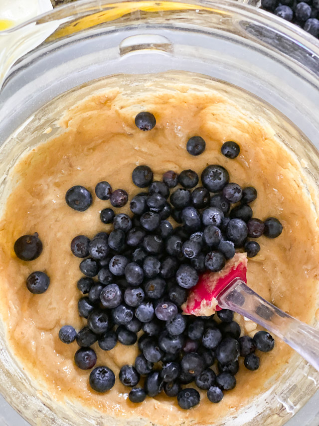 blueberry banana bread batter in a glass bowl