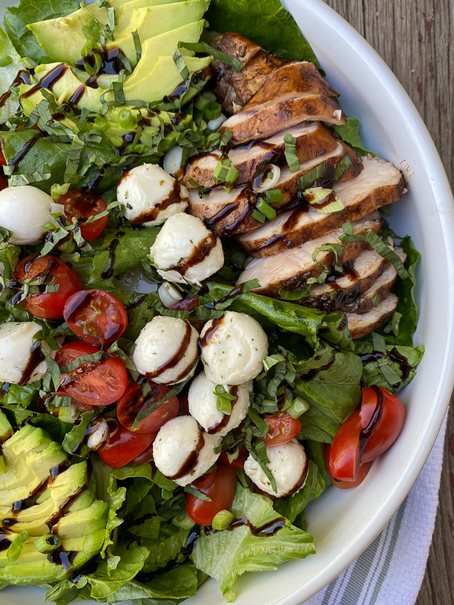 Italian Grilled Chicken Salad on a wood table