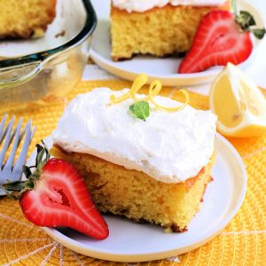 lemonade cake slices on white plates and yellow placement