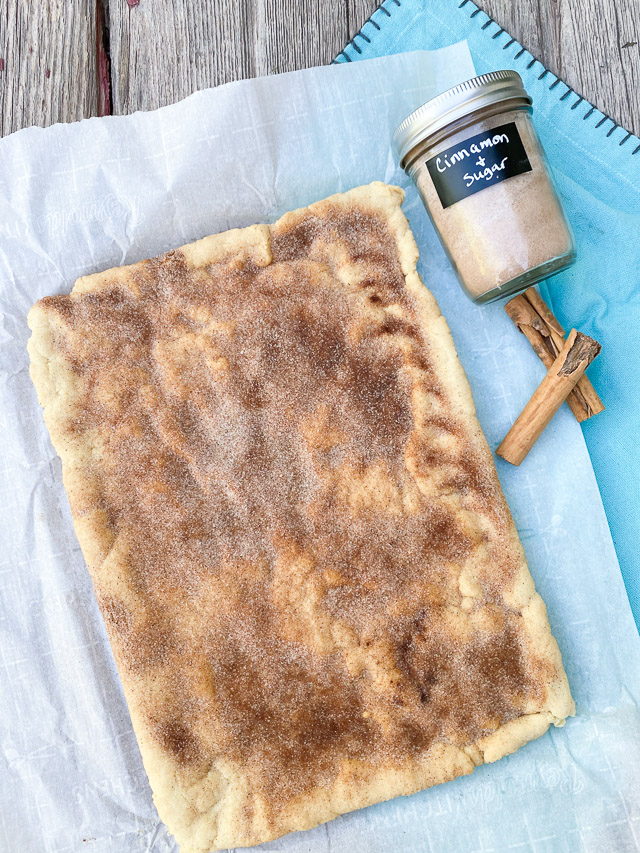 snickerdoodle cookie bars on parchment paper