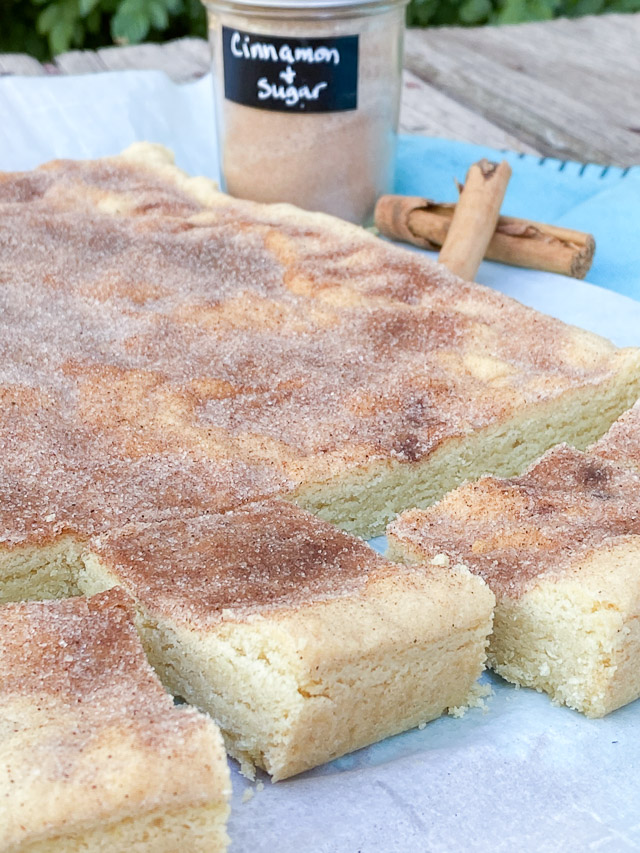 cut snickerdoodle cookie bars on a wood table