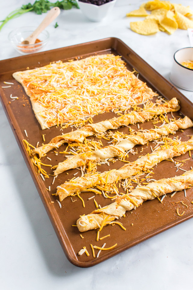 uncooked southwestern cheese breadsticks on baking sheet