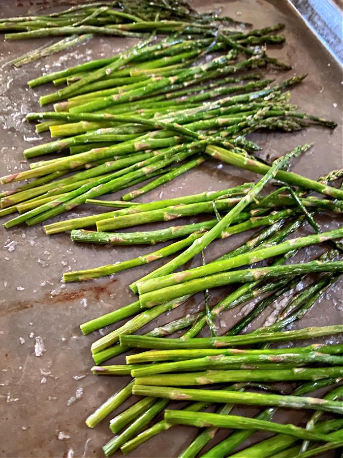 cooked asparagus on a sheet pan