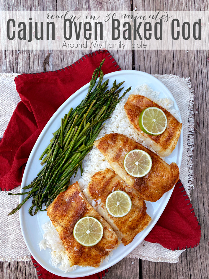 Cajun Oven Baked Cod is ready in under 30 minutes and perfect for a quick weeknight supper (including sides).  Homemade cajun seasoning and ghee, gives the cod so much flavor that the whole family will love it.  via @slingmama