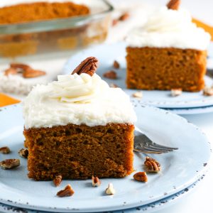 keto pumpkin cake with cream cheese frosting on serving plates