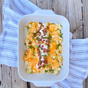 loaded keto cauliflower casserole in a baking dish