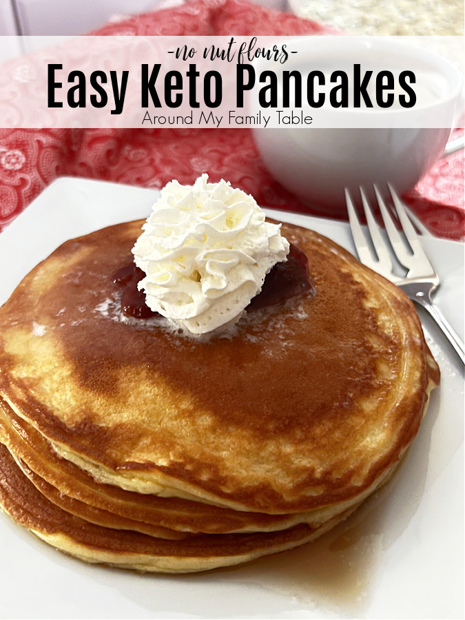 keto pancakes on white plate with a cup of coffee