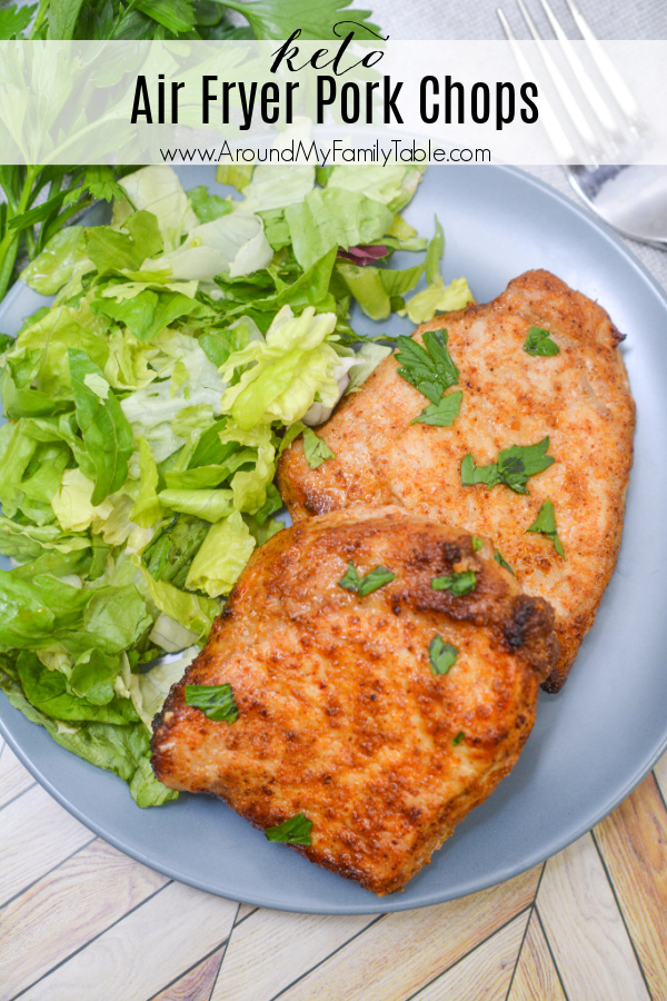 keto air fryer pork chops and salad on a blue plate