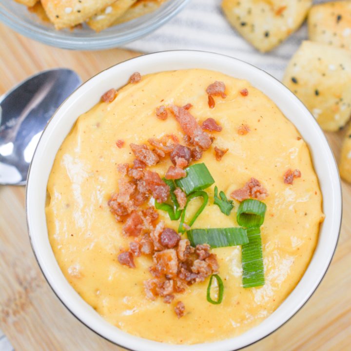 keto beer cheese in a bowl with keto pretzels