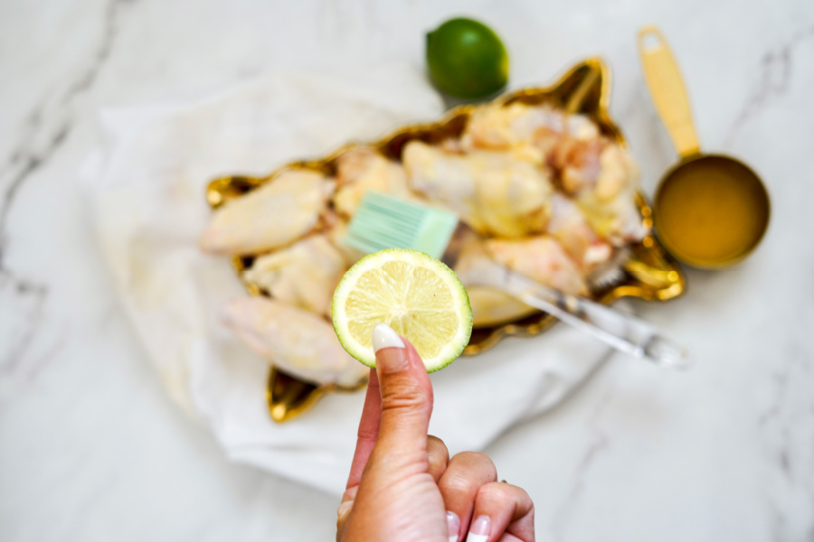 raw chicken wings with lime