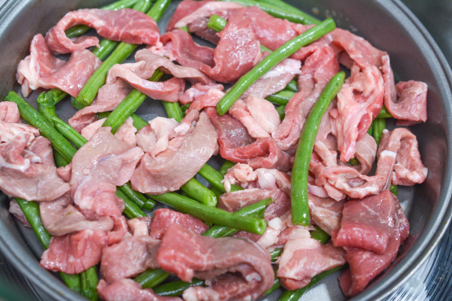 raw beef and green beans in the air fryer