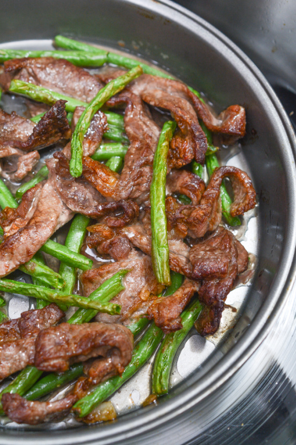 cooked beef and green beans in the air fryer