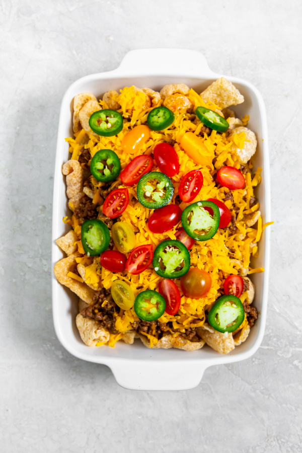 keto walking taco casserole in a white dish