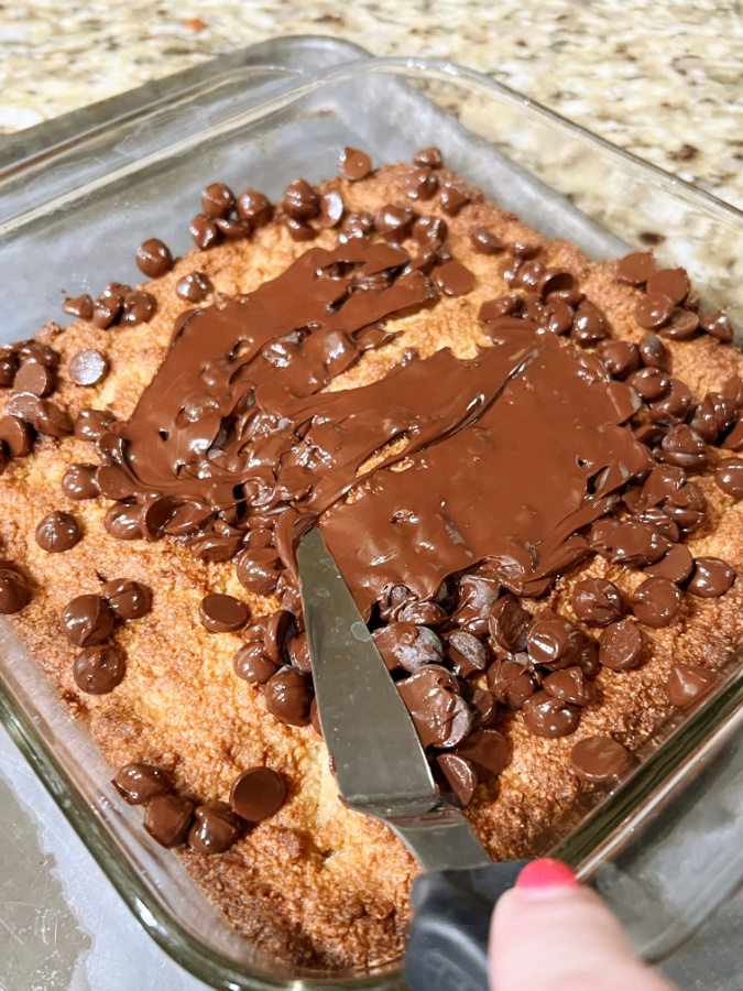 Keto Scotcheroo Cookie Bars in pan with melted chocolate chips