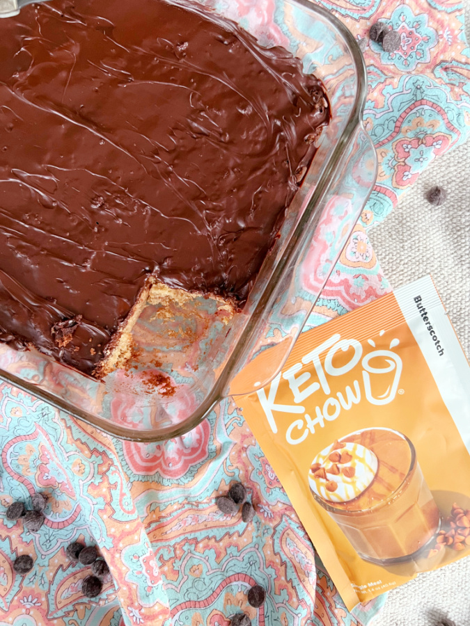 Keto Scotcheroo Cookie Bars on a napkin with Keto Chow